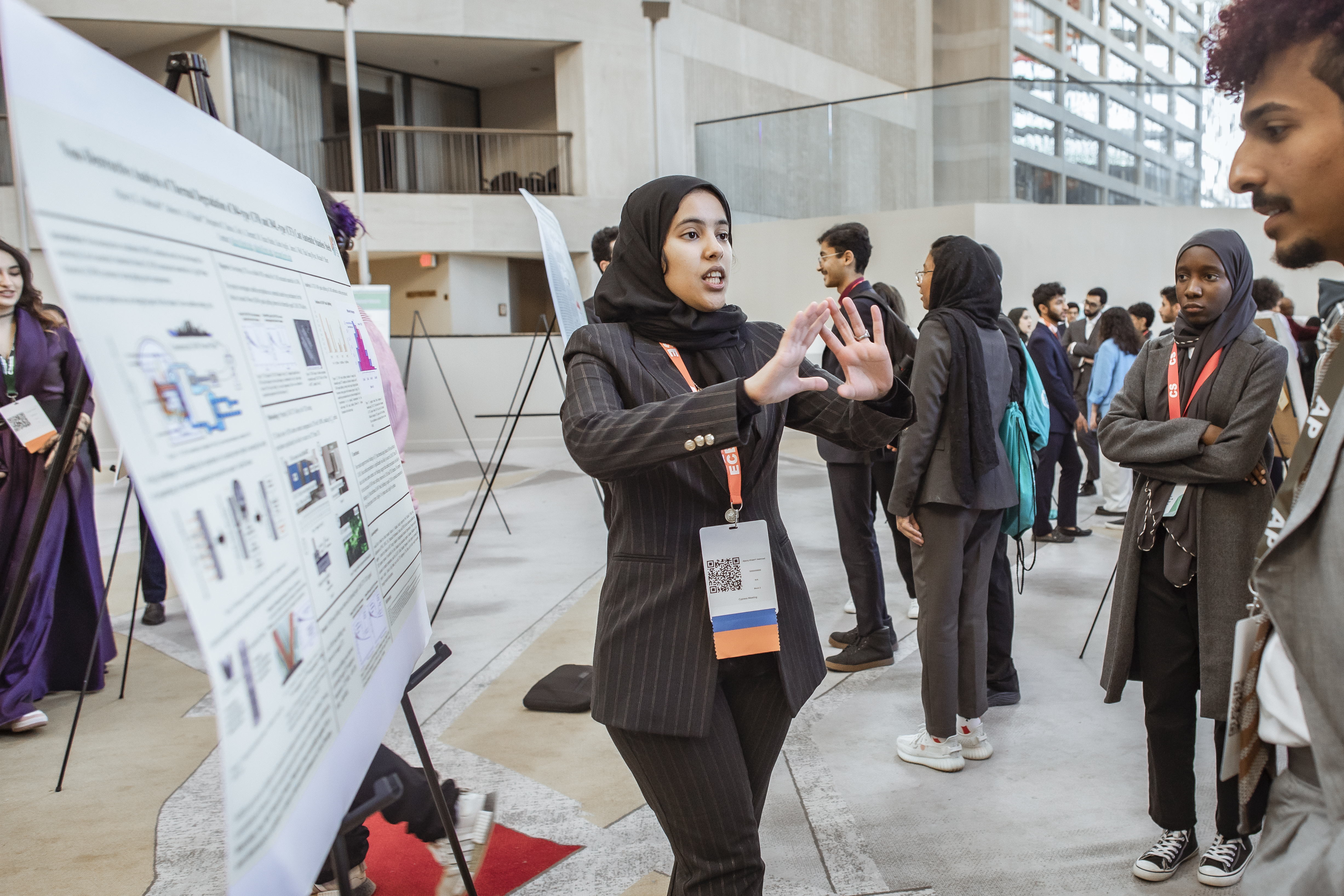 Image 5: KGSP Senior Aljazzy Alahmadi presenting her poster titled, “Non-Destructive Analysis of Thermal Degradation of 304-type (CF8) and 304L-type (CF3) Cast Austenitic Stainless Steels” at the Student Enrichment and Research Fair. 