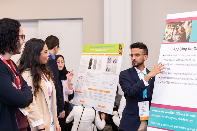 Ahmed at 2020 Convocation explaining how to apply to research opportunities