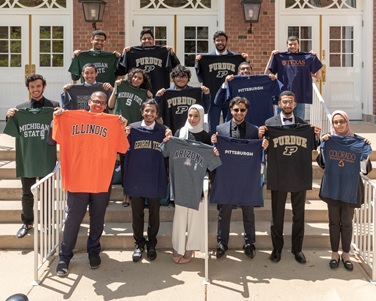University of Illinois at Urbana-Champaign KGSP Foundation Year students proudly displaying shirts of their undergraduate school.