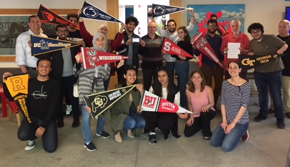 University of Pennsylvania KGSP Foundation Year students with pennants of their undergraduate school.